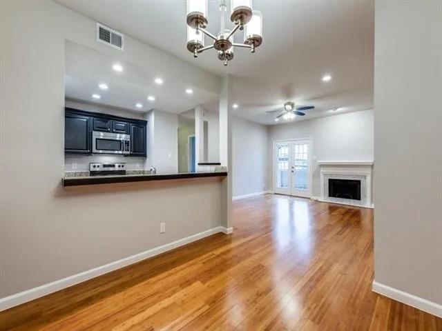 8601 Park Lane, Unit 721 Dallas, TX 75231 - Photo 2 of 5 a view of a kitchen with a dishwasher and a fireplace