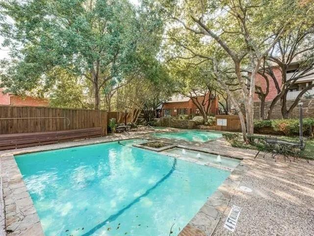 8601 Park Lane, Unit 721 Dallas, TX 75231 - Photo 5 of 5 a swimming pool with wooden fence