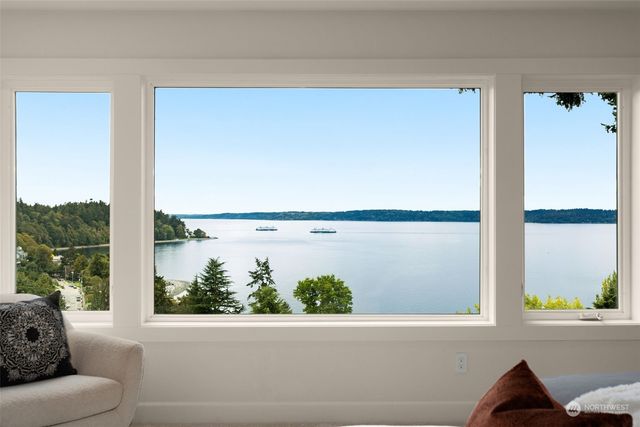 a view of a porch with furniture and a window