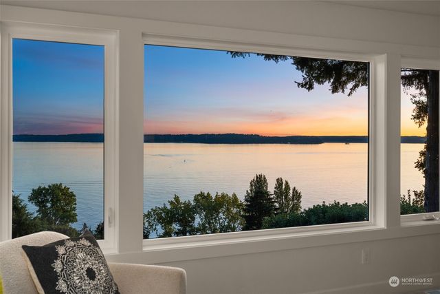 a spacious bathroom with a double vanity sink mirror and shower
