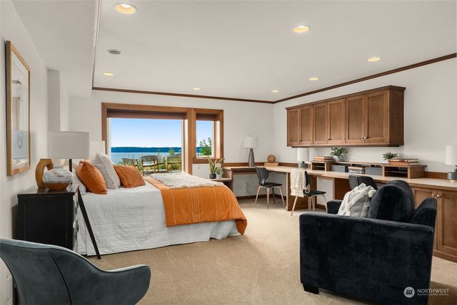 a view of a room with furniture and windows