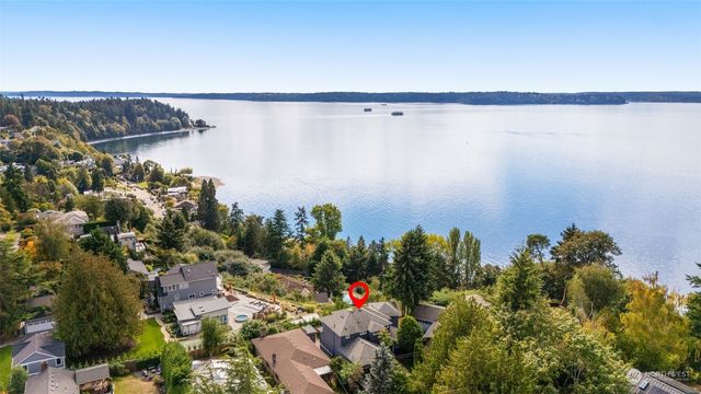 a front view of a house with garden and porch