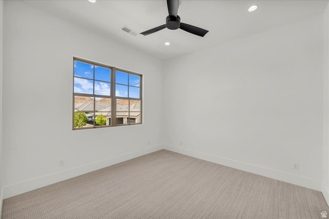 1620 Belayer Drive St. George, UT 84770 - Photo 30 of 51 Interior room featuring a large gridded window, recessed lighting, and a modern ceiling fan