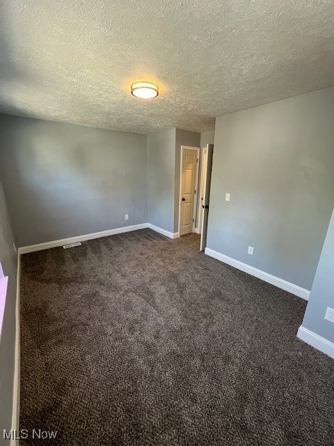 10422 Reno Avenue Cleveland, OH 44105 - Photo 14 of 21 Carpeted empty room with a textured ceiling