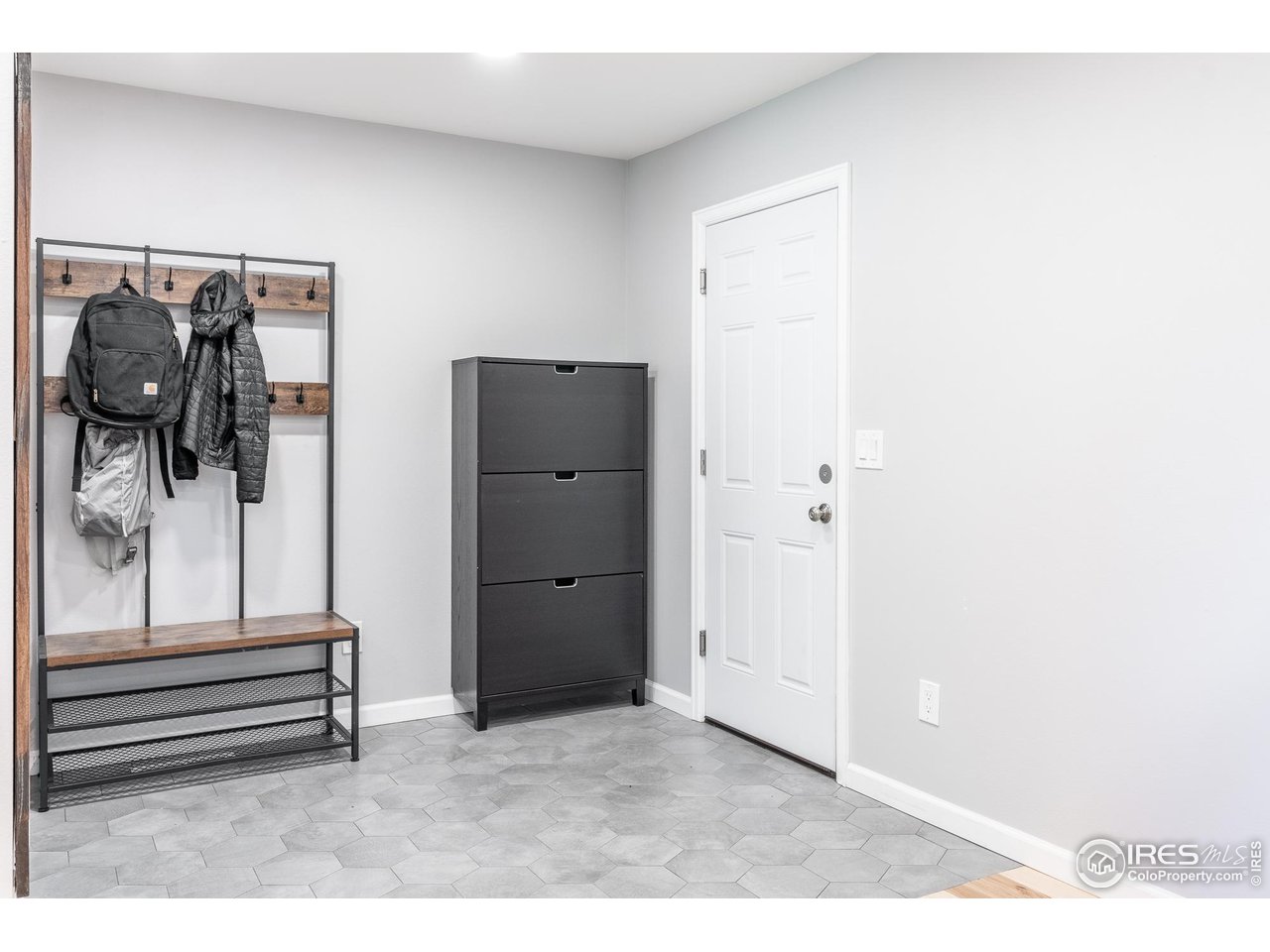 7357 Glacier View Road Longmont, CO 80503 - Photo 16 of 39 a view of a hallway with closet and mirrors