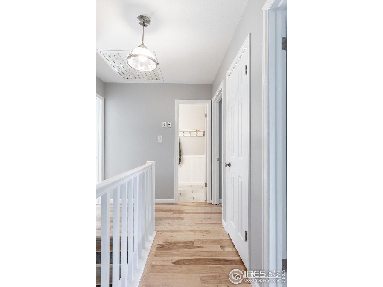 7357 Glacier View Road Longmont, CO 80503 - Photo 17 of 39 a view of a hallway with a white walls