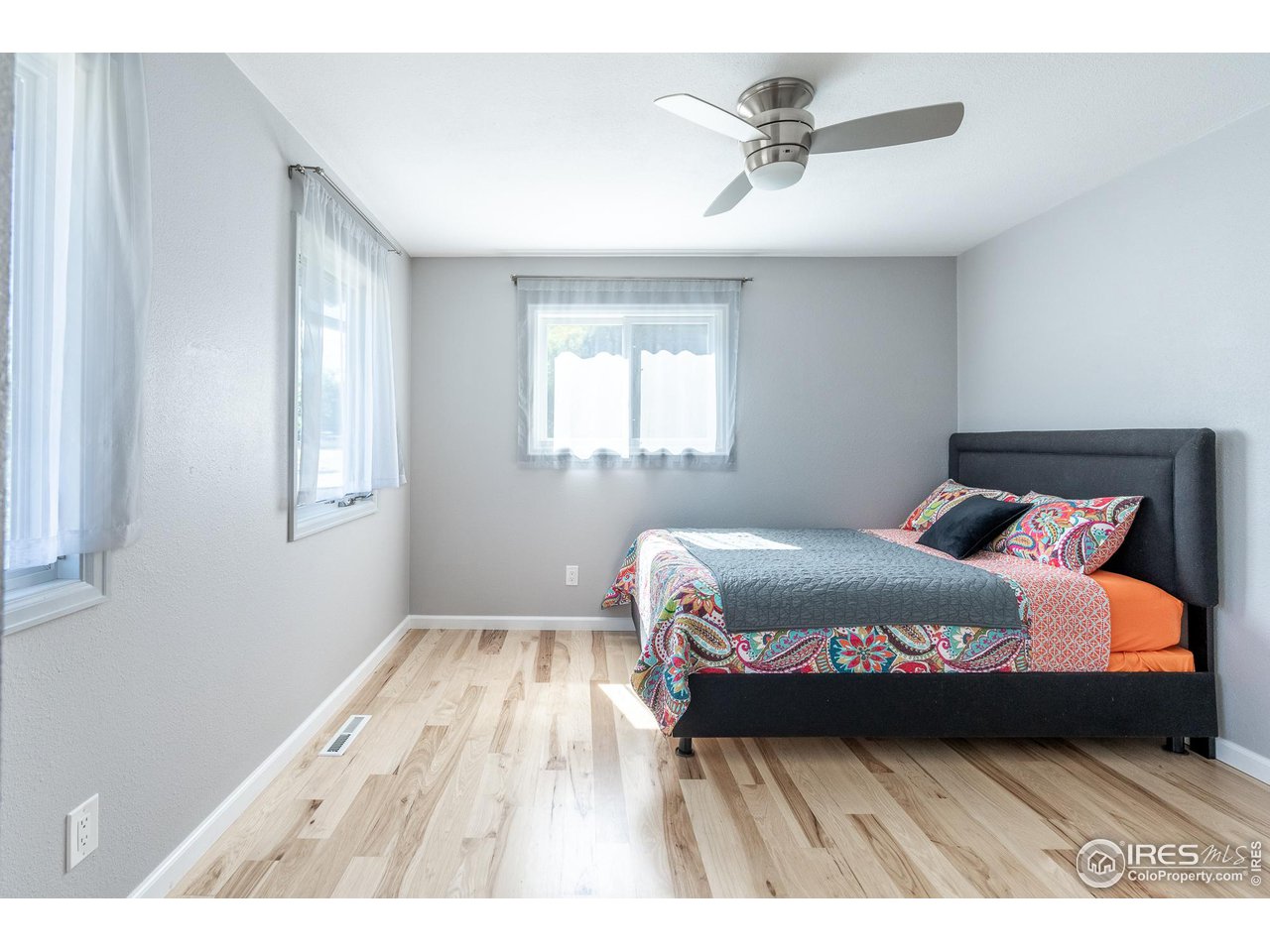 7357 Glacier View Road Longmont, CO 80503 - Photo 24 of 39 a bedroom with a bed and window