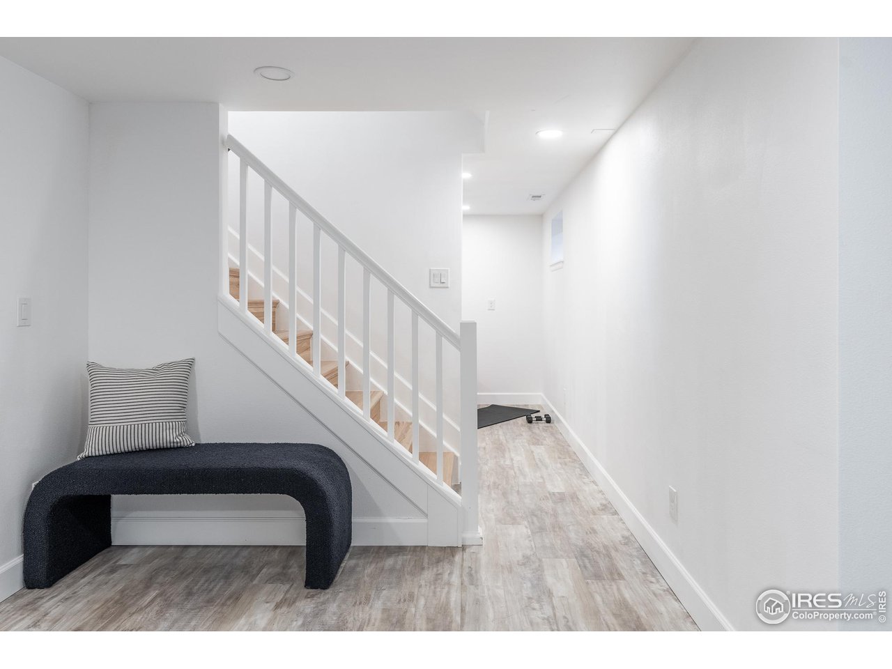7357 Glacier View Road Longmont, CO 80503 - Photo 26 of 39 a view of entryway and hall with wooden floor