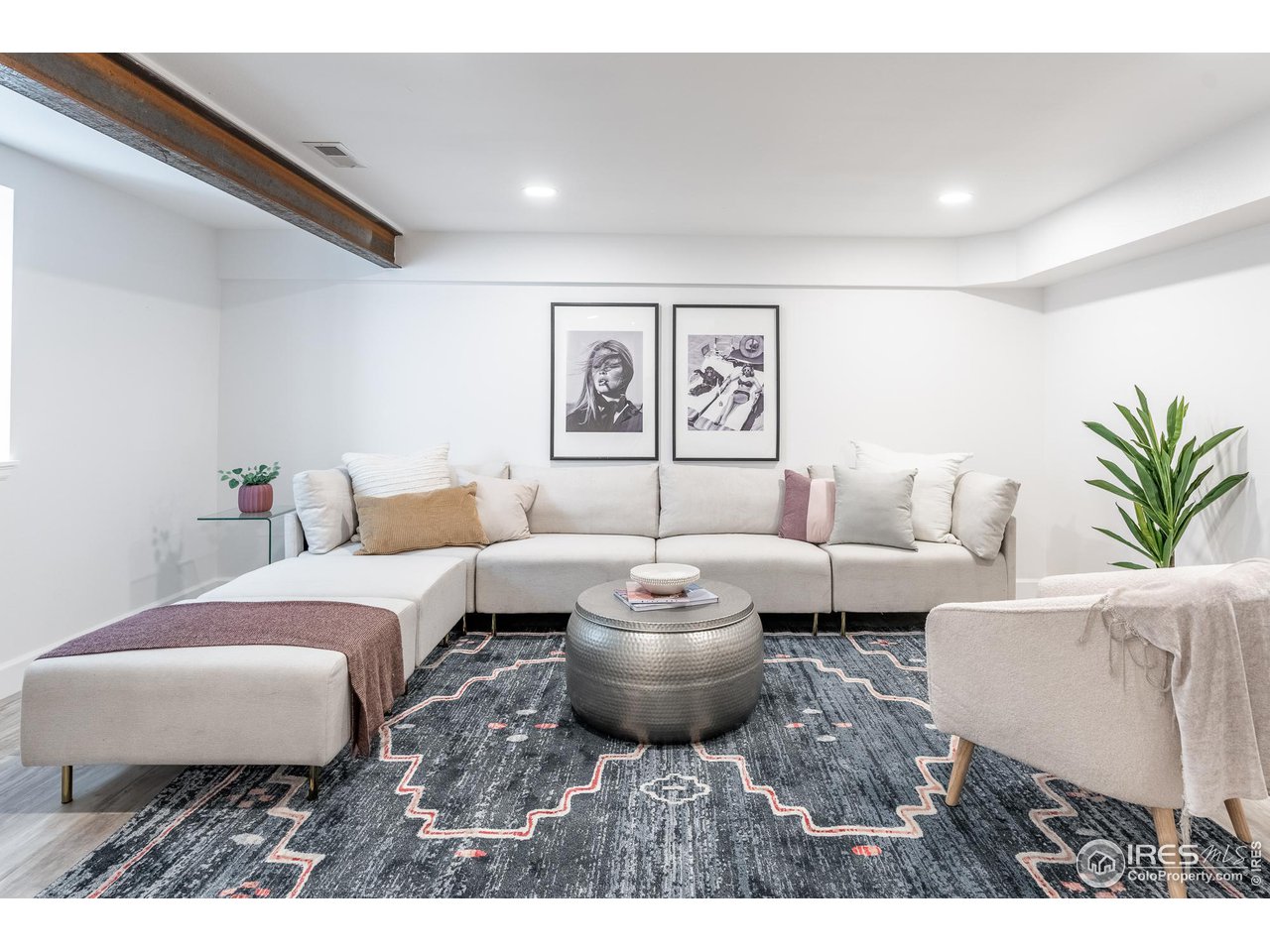 7357 Glacier View Road Longmont, CO 80503 - Photo 27 of 39 a living room with furniture and a painting