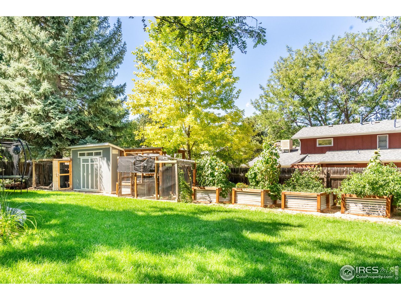 7357 Glacier View Road Longmont, CO 80503 - Photo 33 of 39 a view of a house with a yard
