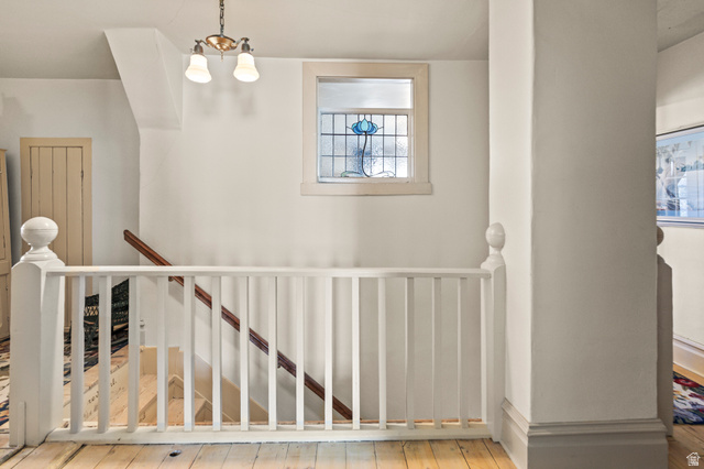 390 North 100 West Monroe, UT 84754 - Photo 87 of 167 Stairs with hardwood / wood-style floors and a chandelier