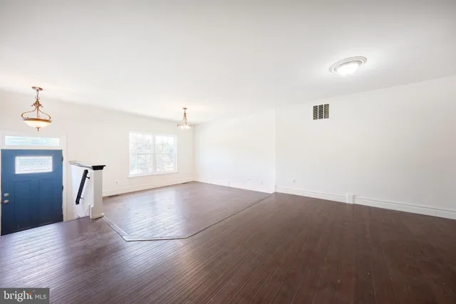 a view of entryway with wooden floor