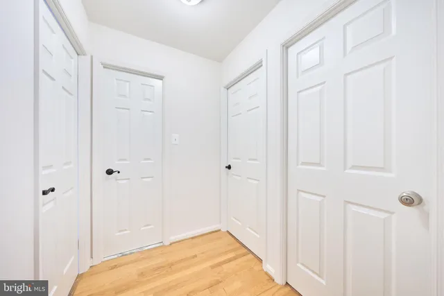 a view of a room with wooden floor