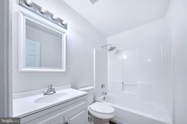 a bathroom with a sink and a window
