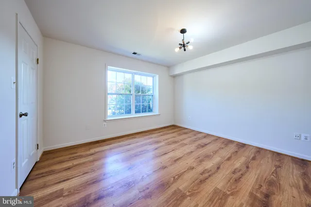 a view of utility room with a fan