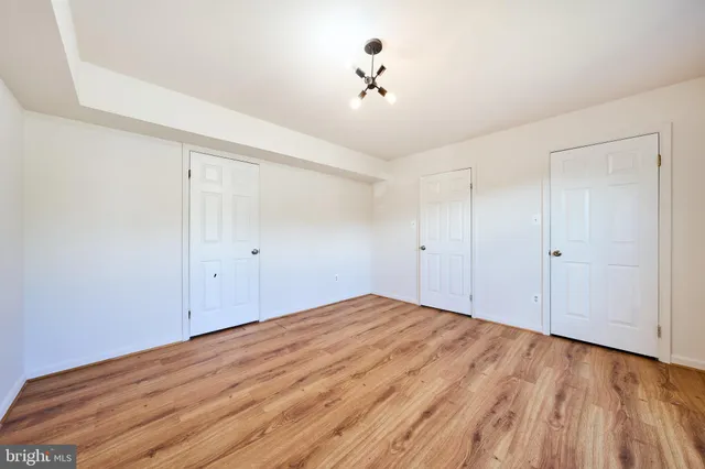 a view of a pathway in a yard with wooden fence
