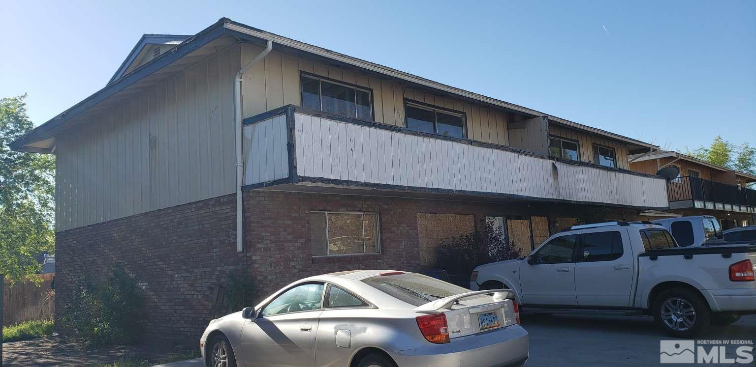 a front view of a house with parking space
