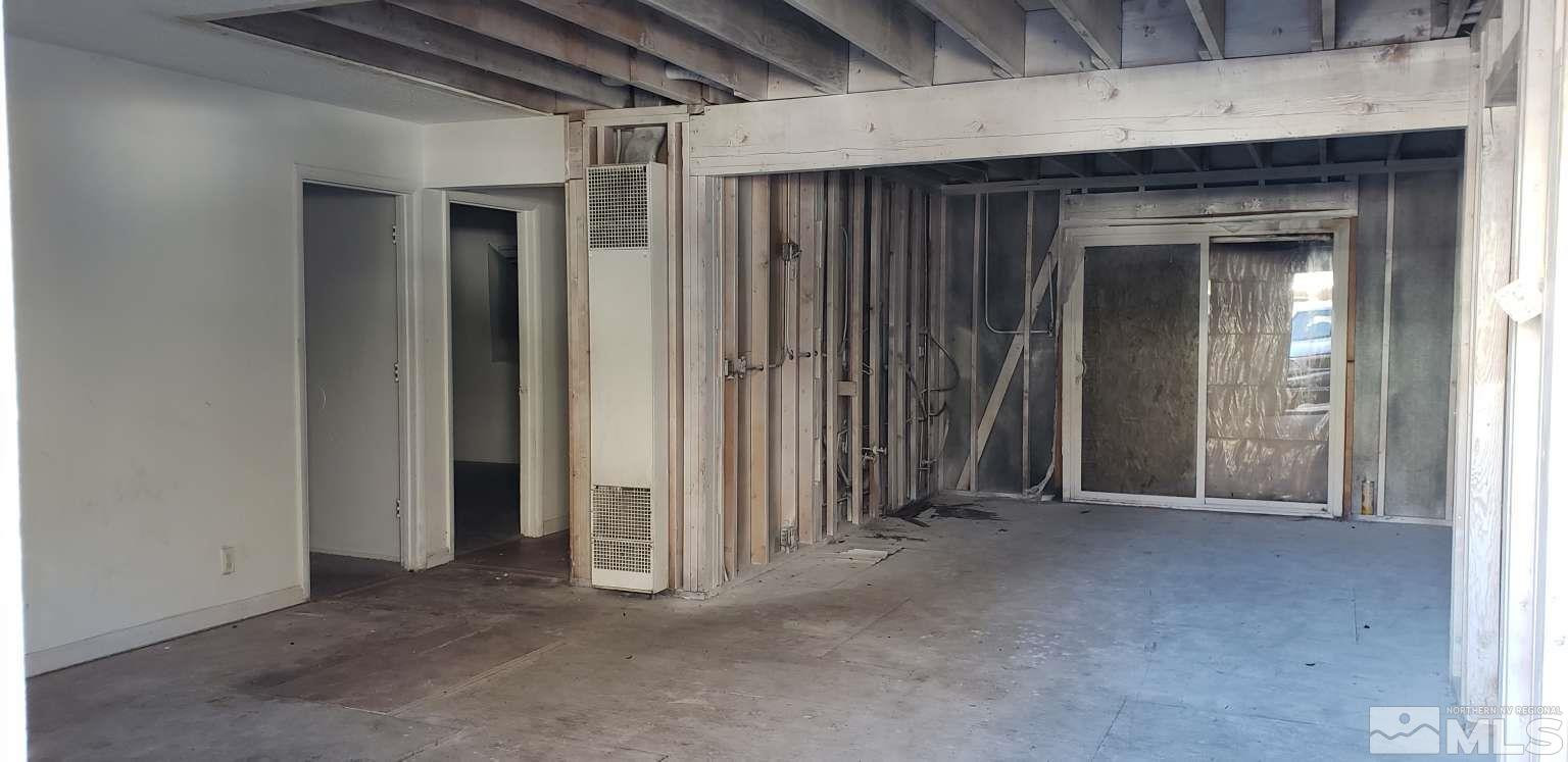 2380 Orange Lane Reno, NV 89502 - Photo 2 of 5 a view of a livingroom with wooden floor and a ceiling fan