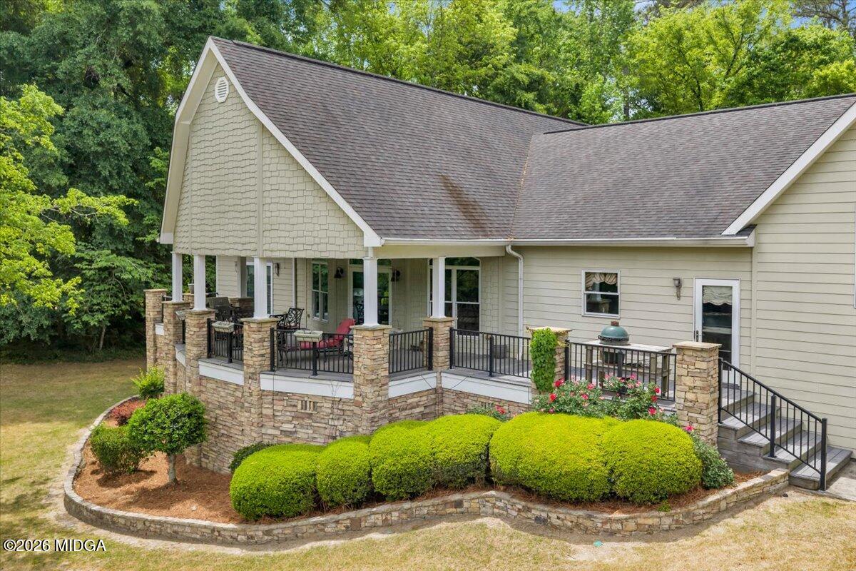 625 Rum Creek Road Juliette, GA 31046 - Photo 15 of 81 a view of house with swimming pool and outdoor seating