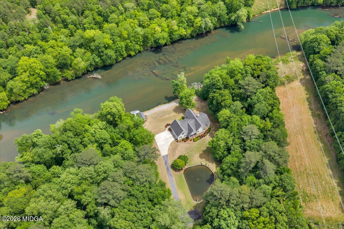 625 Rum Creek Road Juliette, GA 31046 - Photo 16 of 81 an aerial view of a house with a yard and lake view