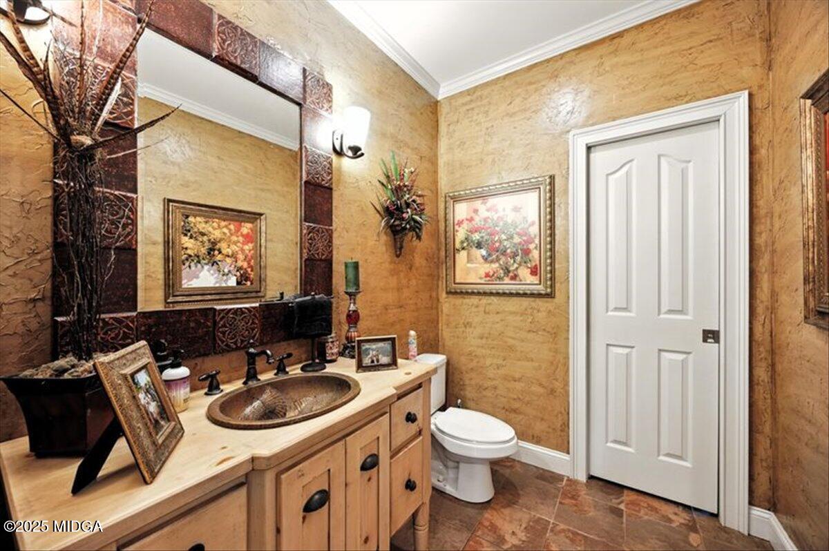 625 Rum Creek Road Juliette, GA 31046 - Photo 43 of 81 a bathroom with a sink a toilet and a mirror