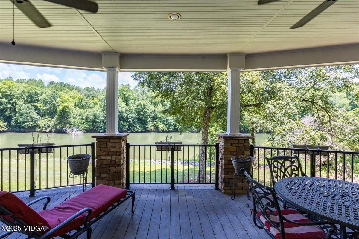 625 Rum Creek Road Juliette, GA 31046 - Photo 56 of 81 a view of a balcony with furniture and wooden floor