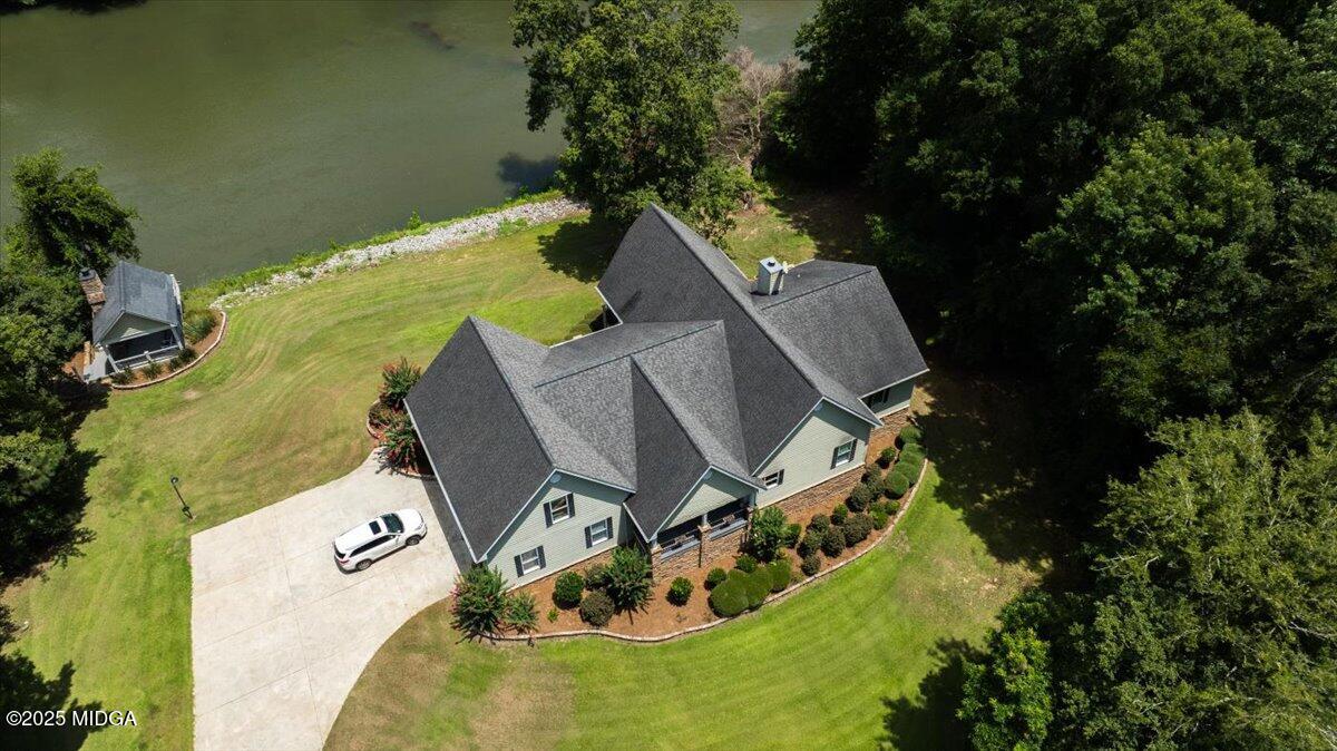 625 Rum Creek Road Juliette, GA 31046 - Photo 65 of 81 an aerial view of a house with outdoor space and a lake view