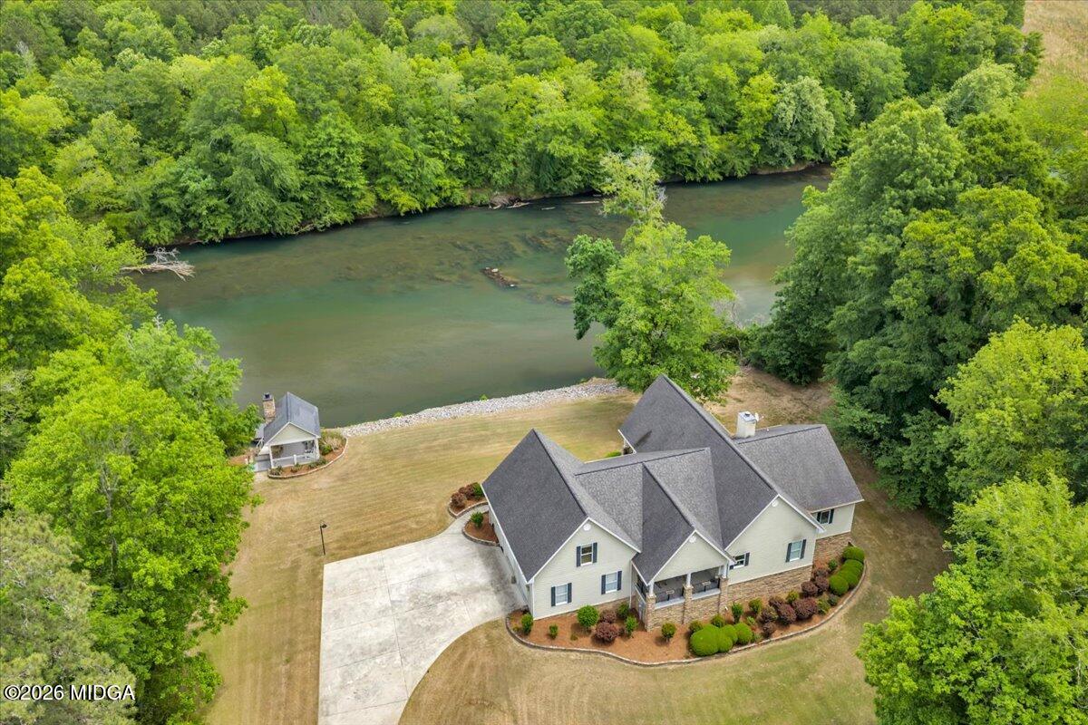 625 Rum Creek Road Juliette, GA 31046 - Photo 10 of 81 an aerial view of a house with outdoor space and a lake view