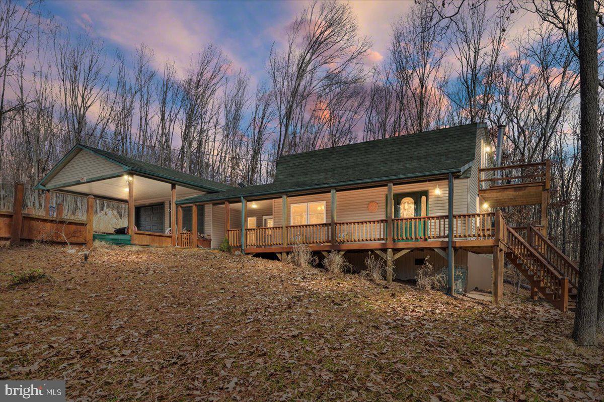 165 Buck Run Delray, WV 26714 - Photo 1 of 23 a view of a backyard with a large tree