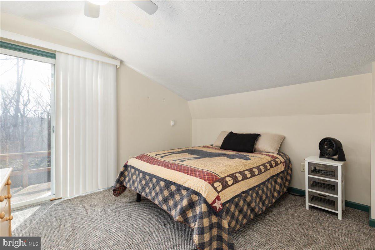 165 Buck Run Delray, WV 26714 - Photo 13 of 23 a bedroom with a bed and a window