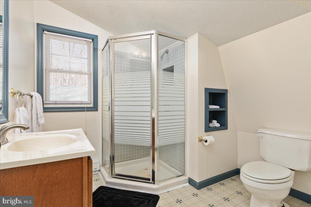 165 Buck Run Delray, WV 26714 - Photo 17 of 23 a bathroom with a sink toilet and shower