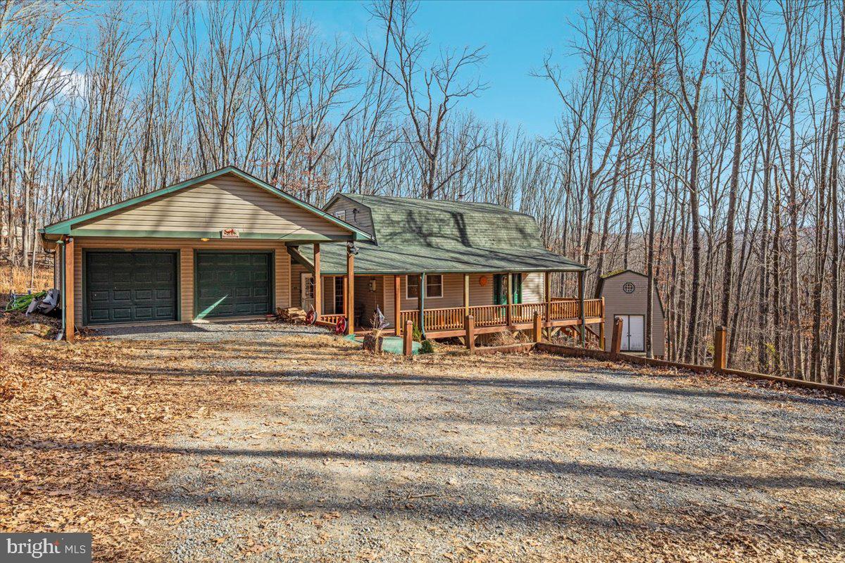 165 Buck Run Delray, WV 26714 - Photo 23 of 23 a front view of a house with a garden