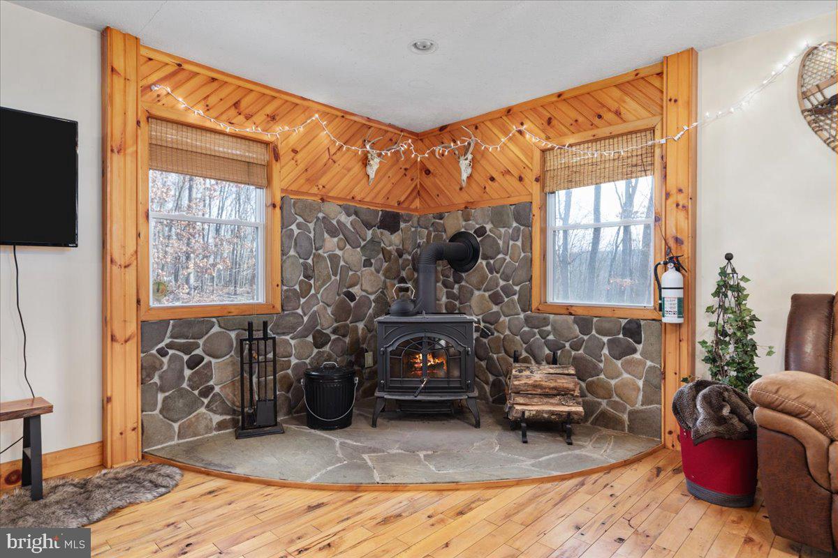 165 Buck Run Delray, WV 26714 - Photo 8 of 23 a living room with furniture a window and a fireplace