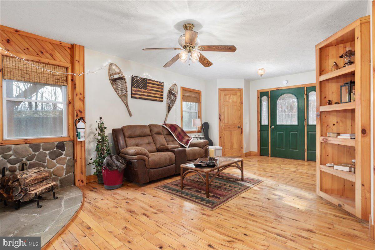 165 Buck Run Delray, WV 26714 - Photo 9 of 23 a living room with furniture a window and a chandelier