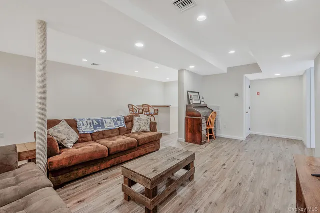 a kitchen with a refrigerator sink stove and white cabinets