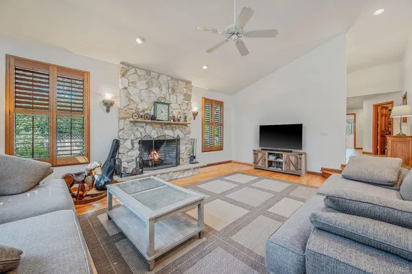 a dining room with lots of furniture and wooden floor