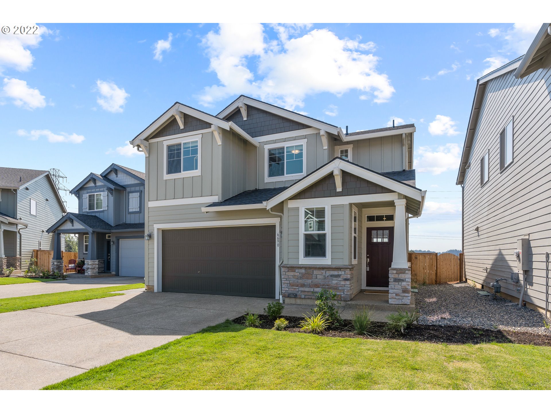 6690 North 89th Loop Camas, WA 98607 - Photo 1 of 24 a front view of a house with a yard