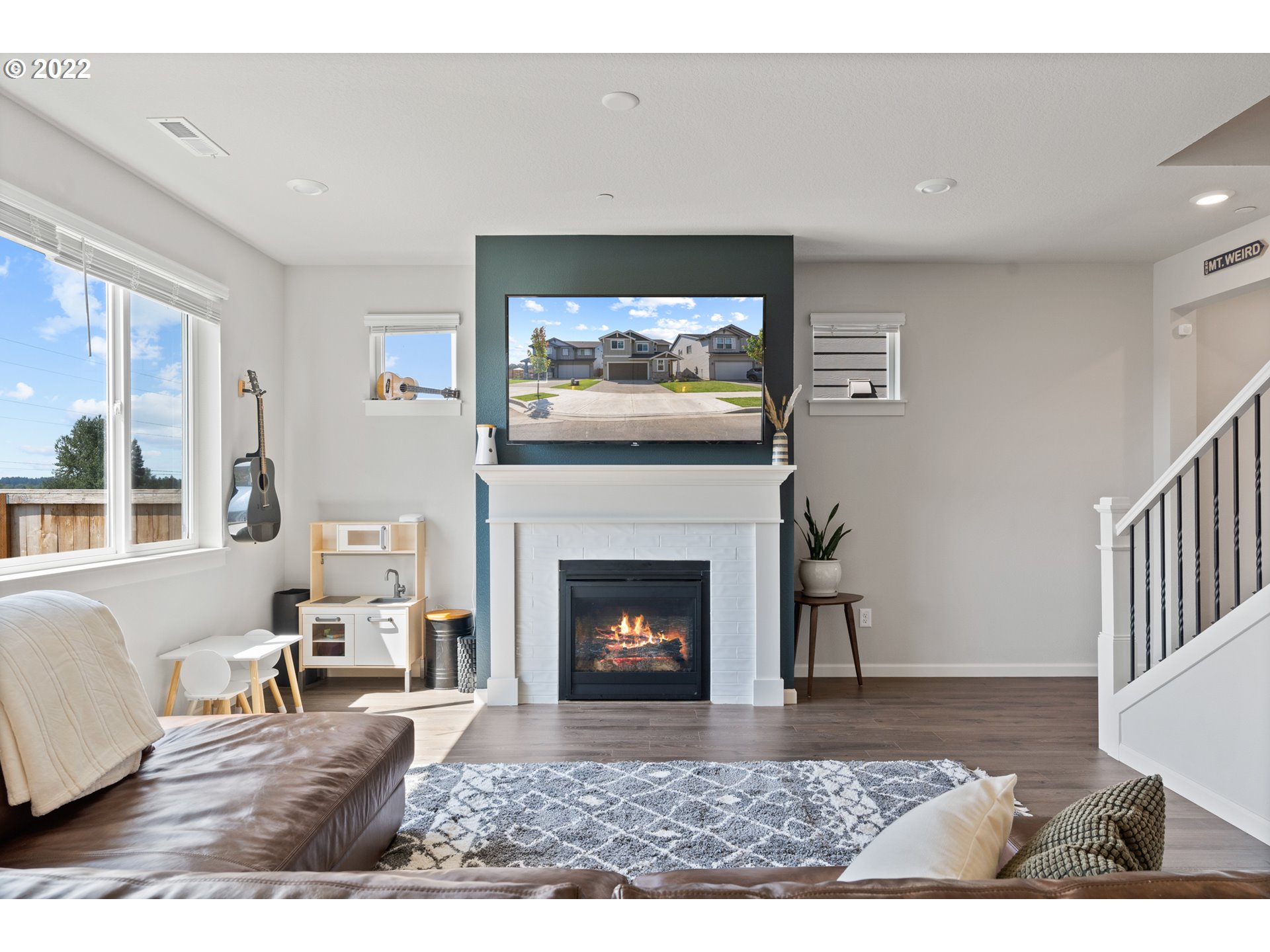 6690 North 89th Loop Camas, WA 98607 - Photo 12 of 24 a living room with furniture and a fireplace