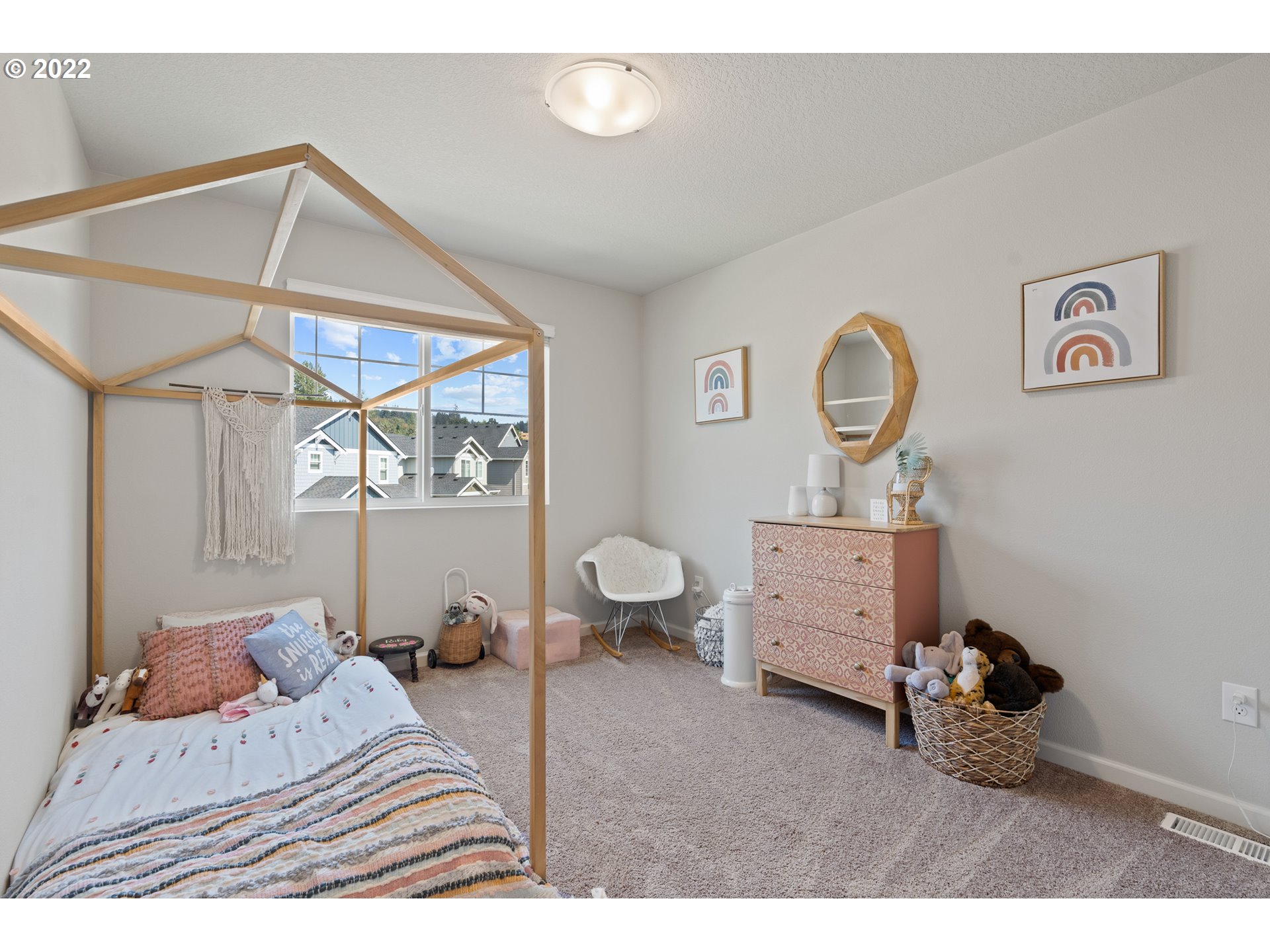 6690 North 89th Loop Camas, WA 98607 - Photo 18 of 24 a bedroom with furniture and a window
