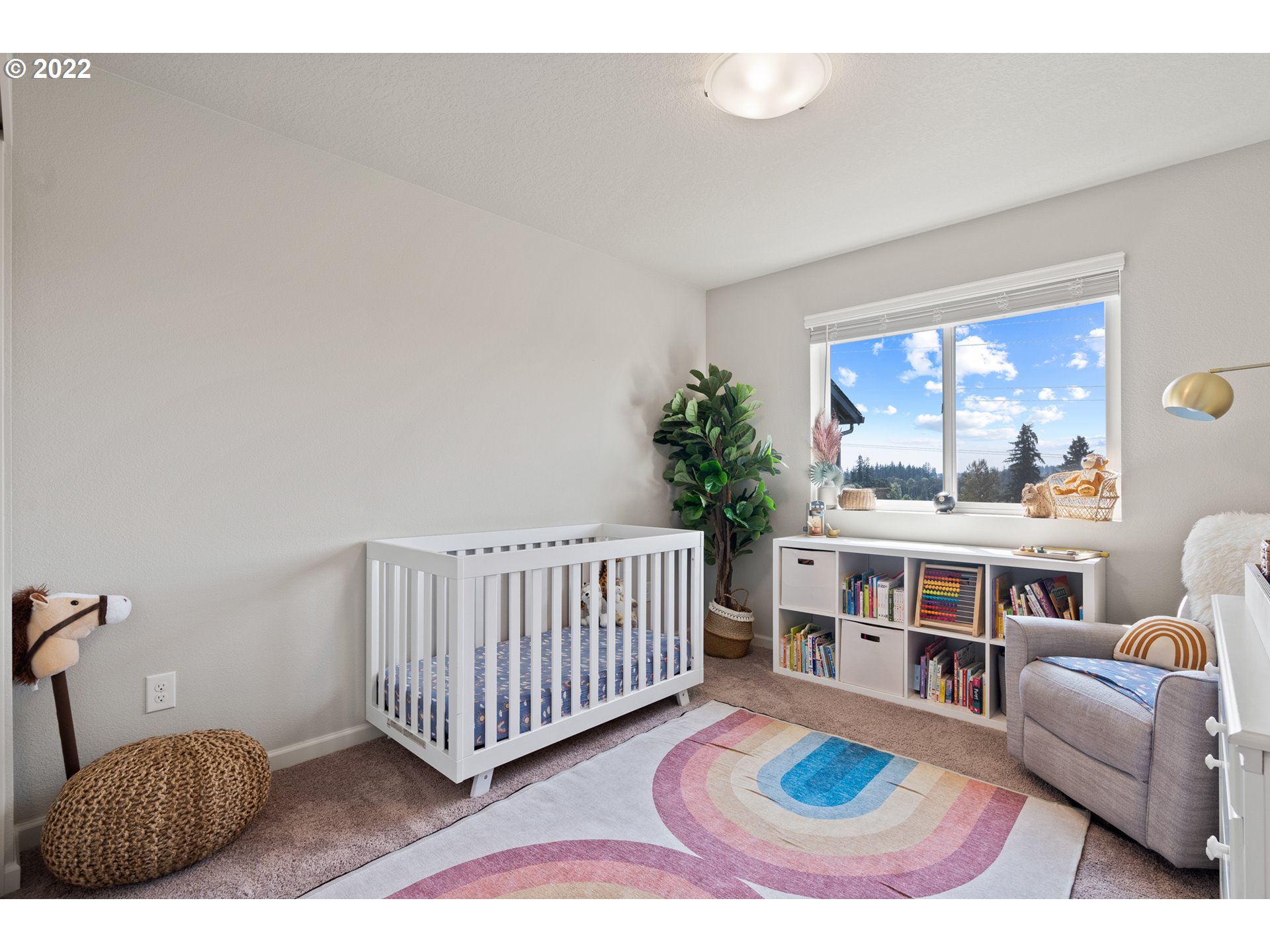 6690 North 89th Loop Camas, WA 98607 - Photo 19 of 24 a living room with furniture rug and window