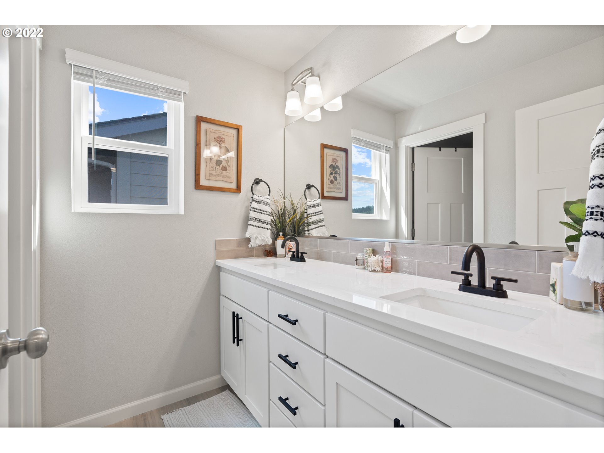 6690 North 89th Loop Camas, WA 98607 - Photo 20 of 24 a bathroom with a sink and a mirror