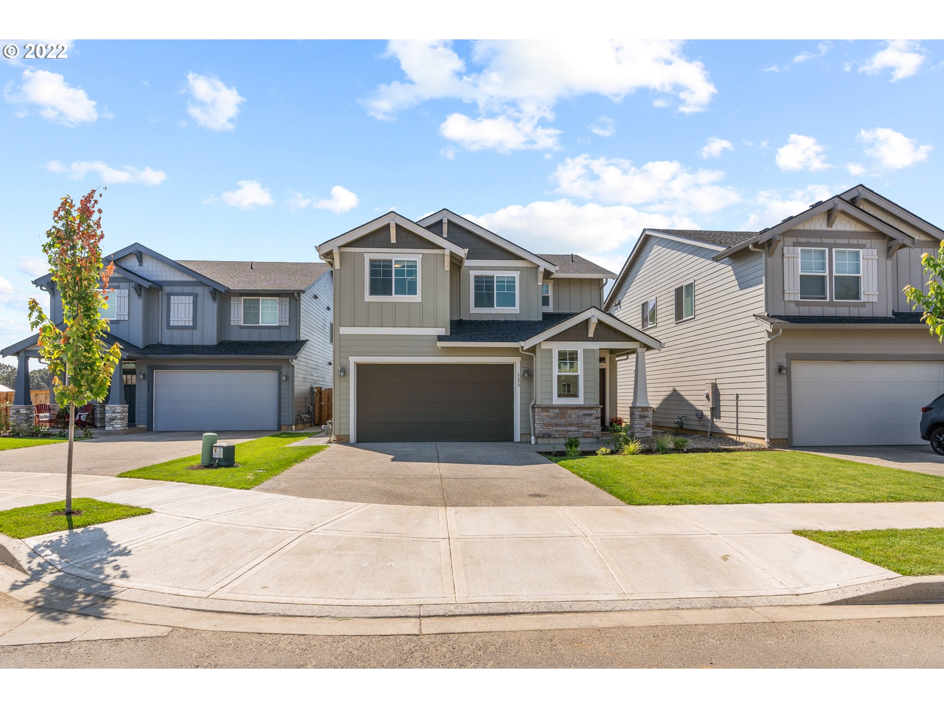 6690 North 89th Loop Camas, WA 98607 - Photo 2 of 24 a view of a house with a swimming pool and a yard