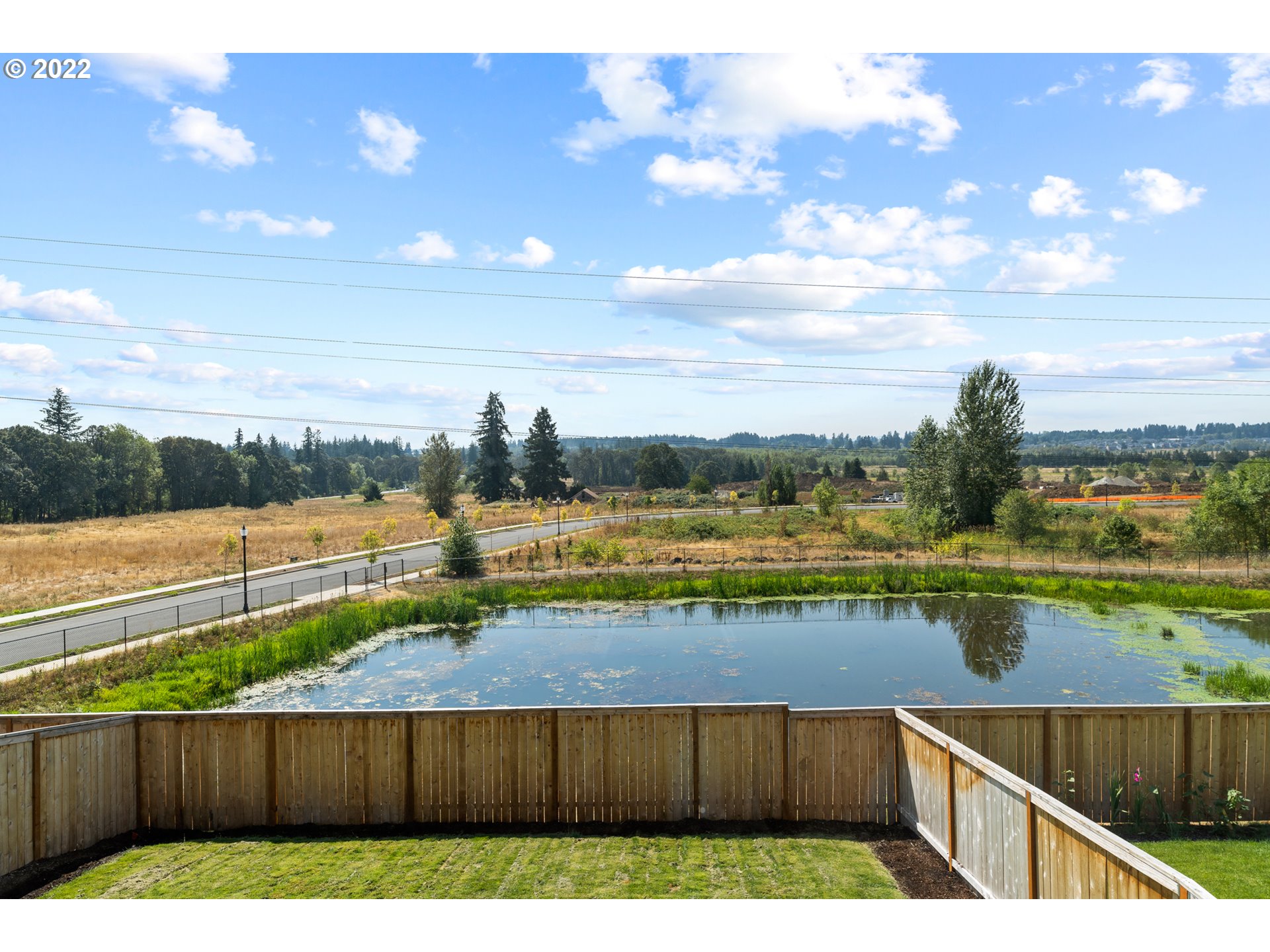 6690 North 89th Loop Camas, WA 98607 - Photo 21 of 24 a view of swimming pool with outdoor seating and lake