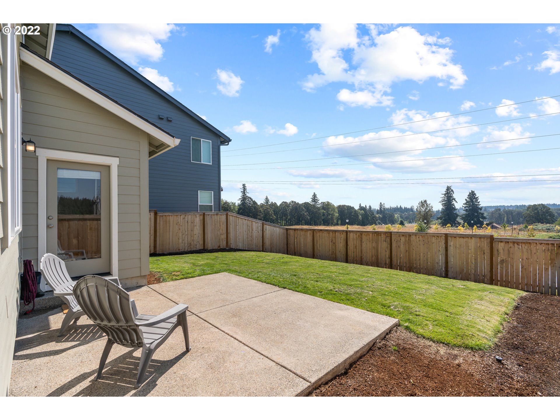 6690 North 89th Loop Camas, WA 98607 - Photo 22 of 24 a view of a backyard with a sitting area