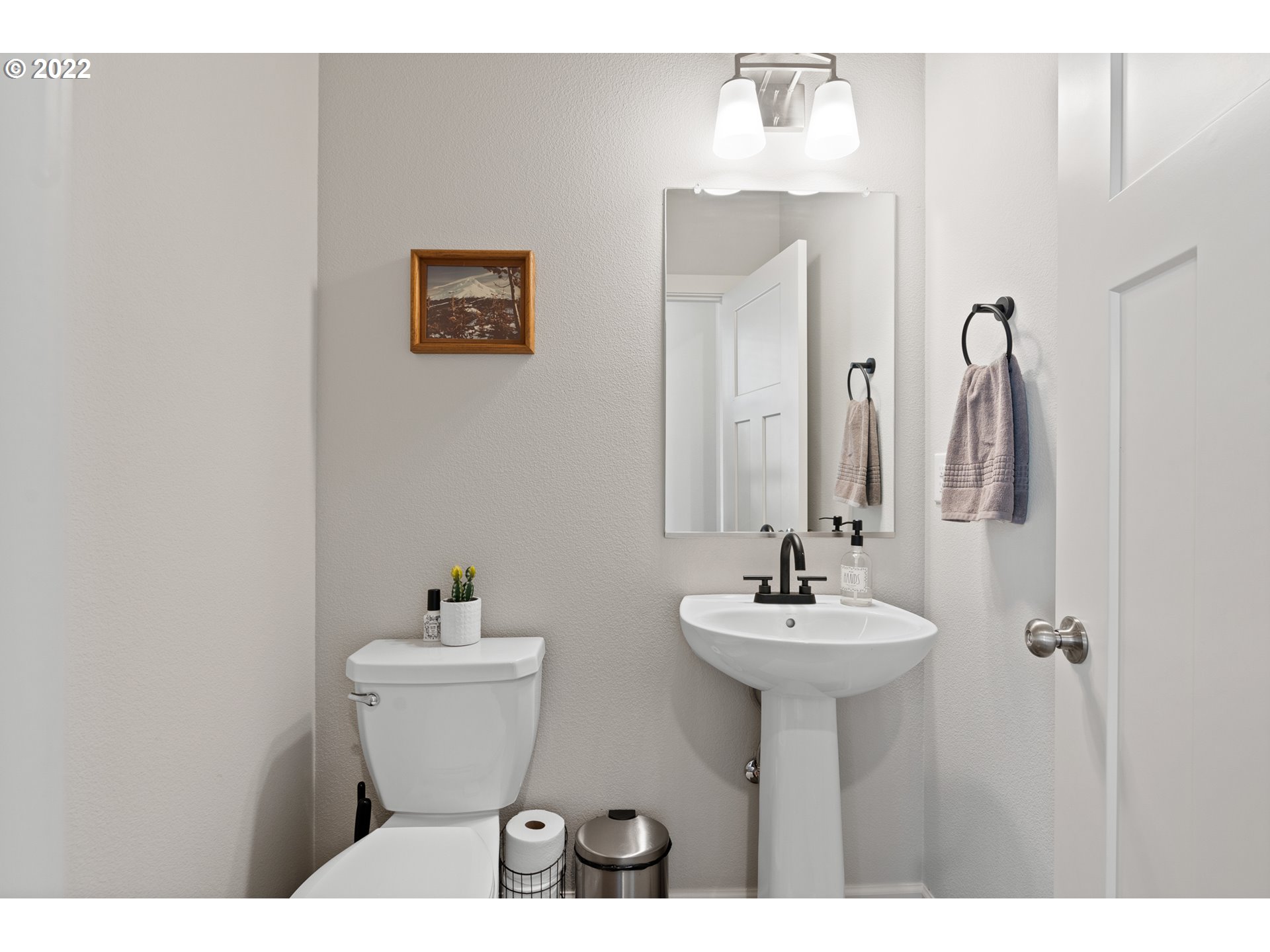 6690 North 89th Loop Camas, WA 98607 - Photo 5 of 24 a bathroom with a sink and a mirror
