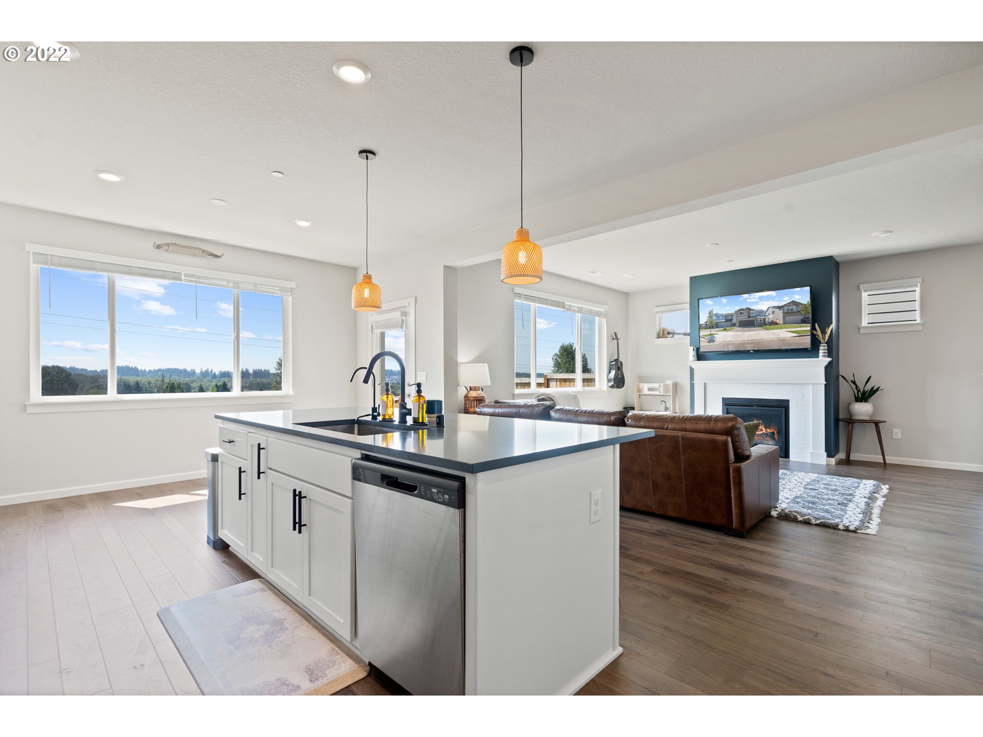 6690 North 89th Loop Camas, WA 98607 - Photo 6 of 24 a kitchen with stainless steel appliances granite countertop a sink cabinets and window
