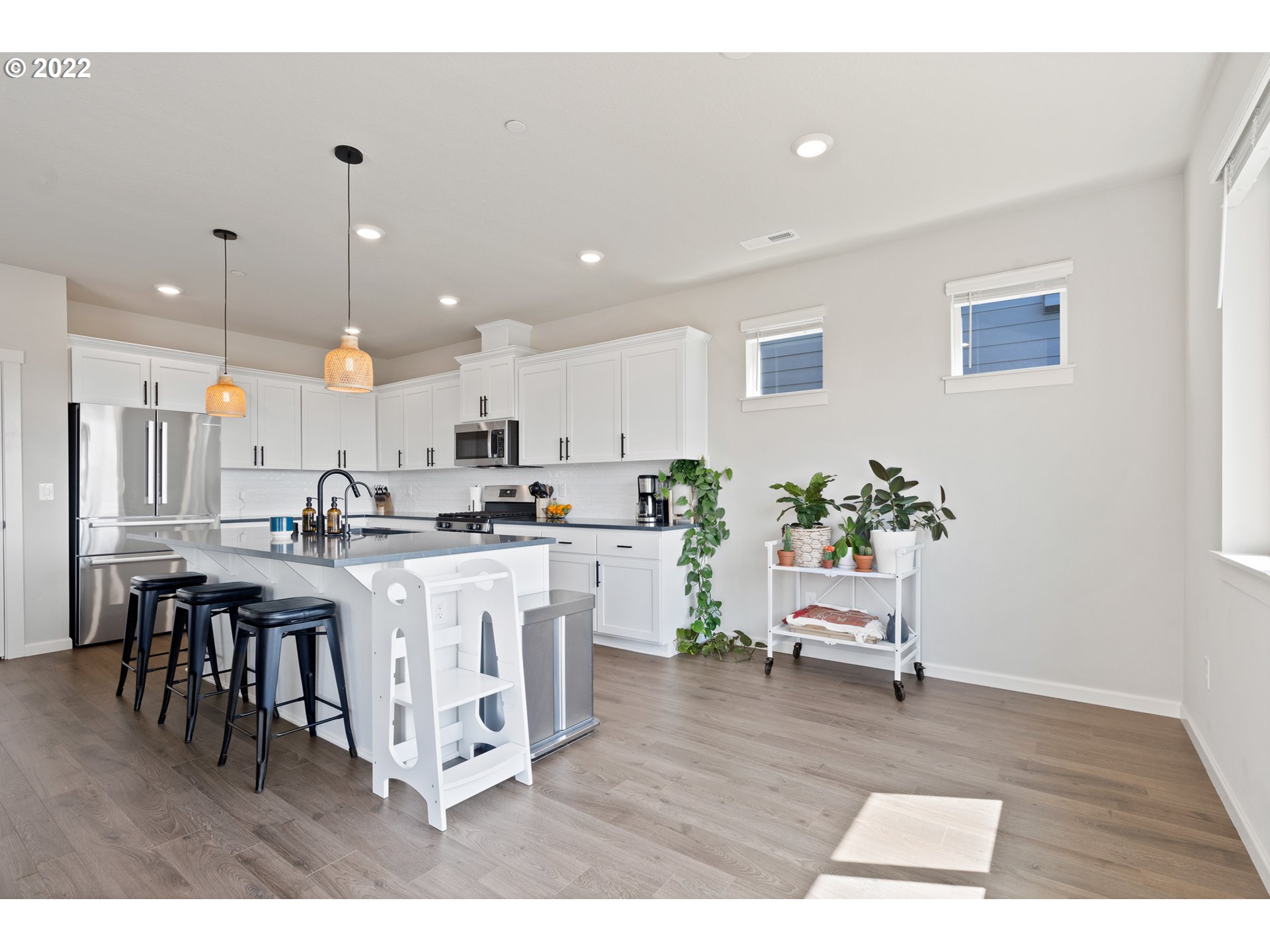 6690 North 89th Loop Camas, WA 98607 - Photo 9 of 24 a kitchen with a table and chairs