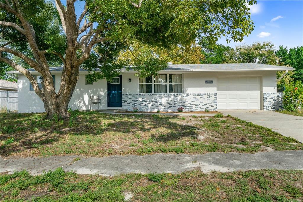 a front view of a house with yard