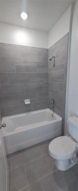 51 Kankakee Trail Palm Coast, FL 32164 - Photo 5 of 14 a bathroom with a toilet a sink and bathtub