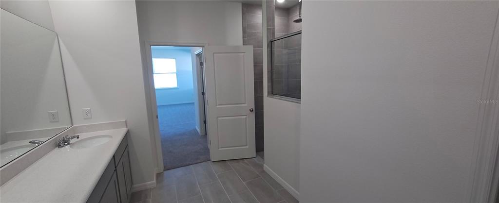 51 Kankakee Trail Palm Coast, FL 32164 - Photo 9 of 14 a bathroom with a sink and mirror